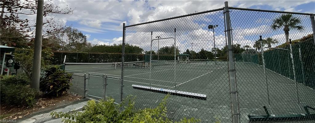 6780 Dennis Circle, Unit M103 Naples, FL 34104 - Photo 19 of 23 a view of a tennis court