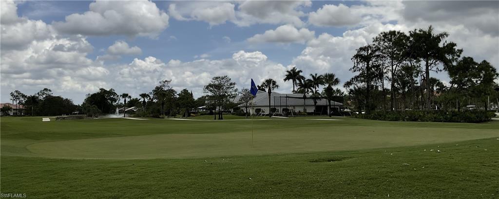 6780 Dennis Circle, Unit M103 Naples, FL 34104 - Photo 20 of 23 a view of a golf course with a big yard