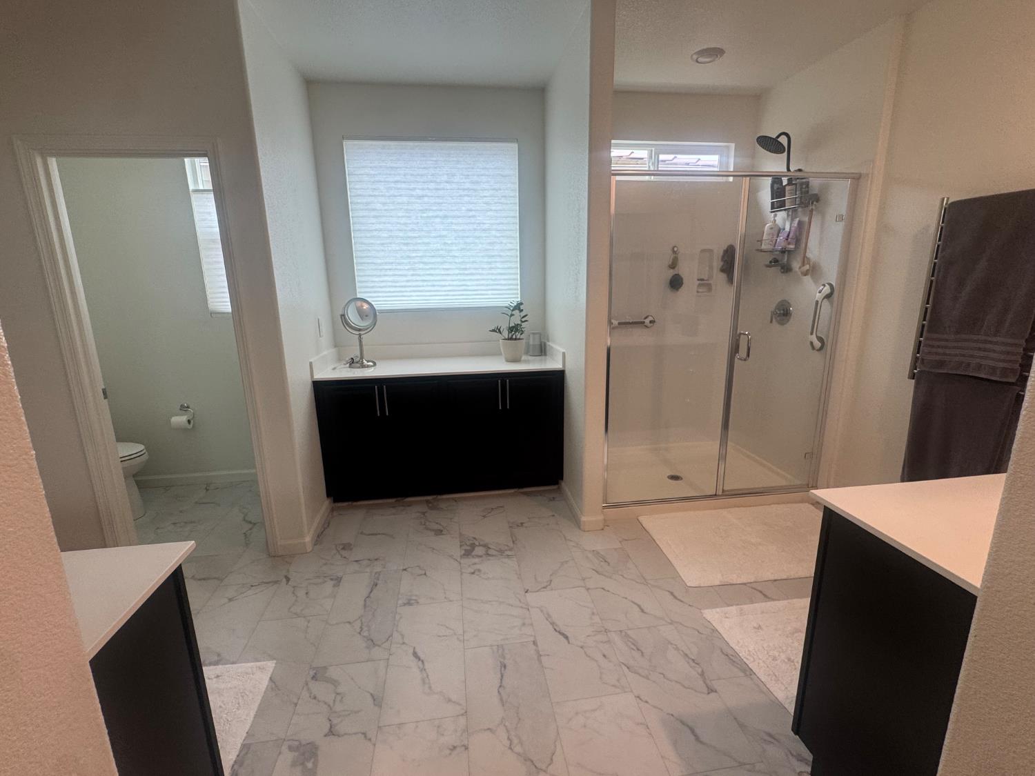 9475 Pasaje Place Elk Grove, CA 95624 - Photo 11 of 26 a bathroom with a bathtub and a shower