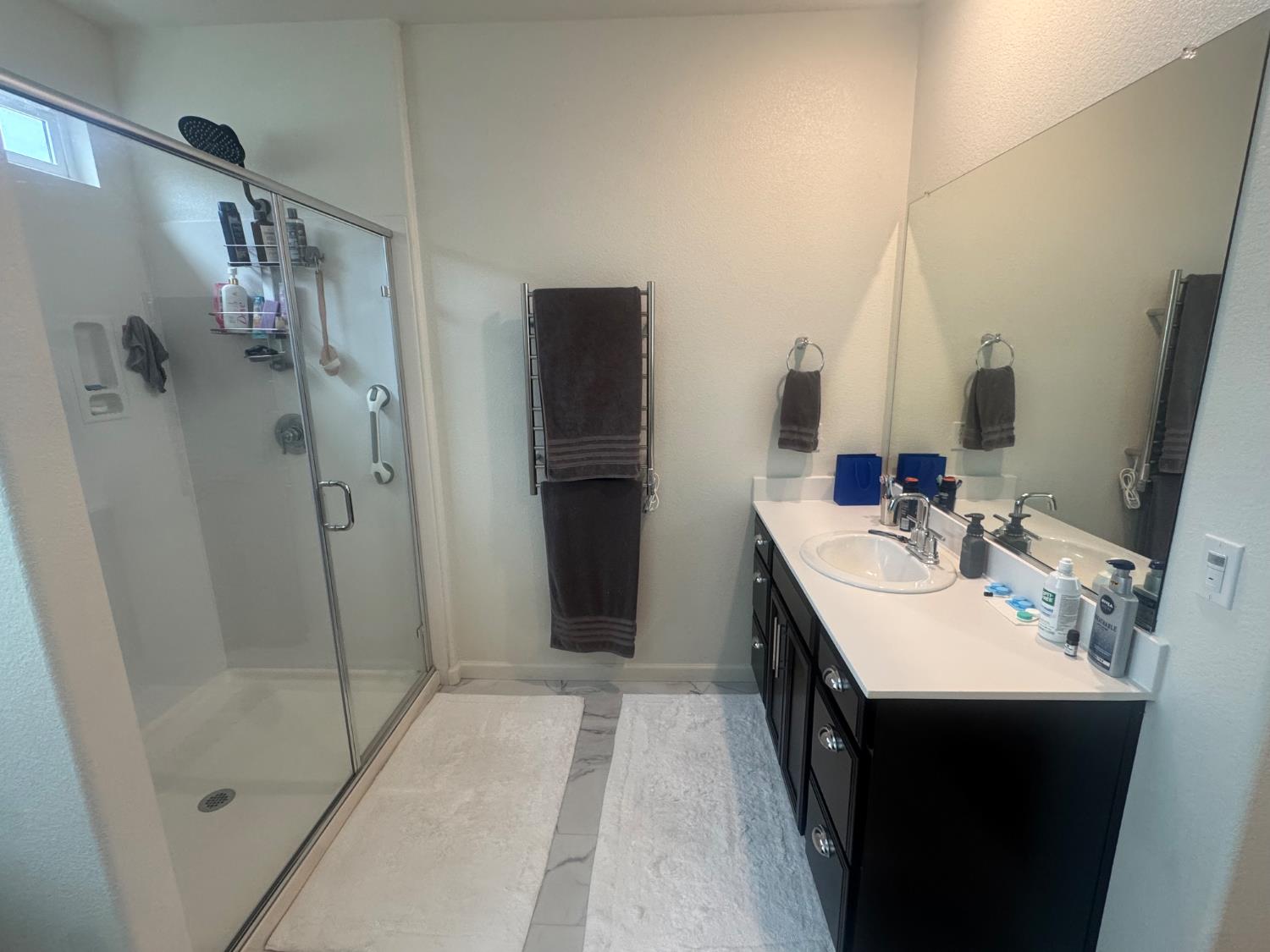 9475 Pasaje Place Elk Grove, CA 95624 - Photo 12 of 26 a bathroom with a double vanity sink and mirror