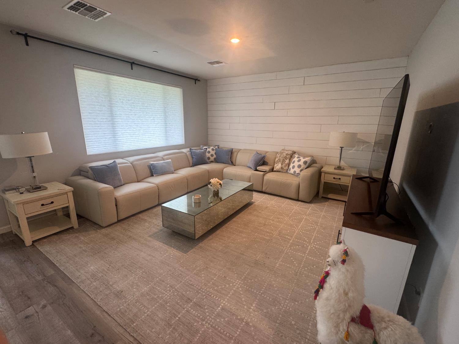 9475 Pasaje Place Elk Grove, CA 95624 - Photo 17 of 26 a living room with furniture and a flat screen tv