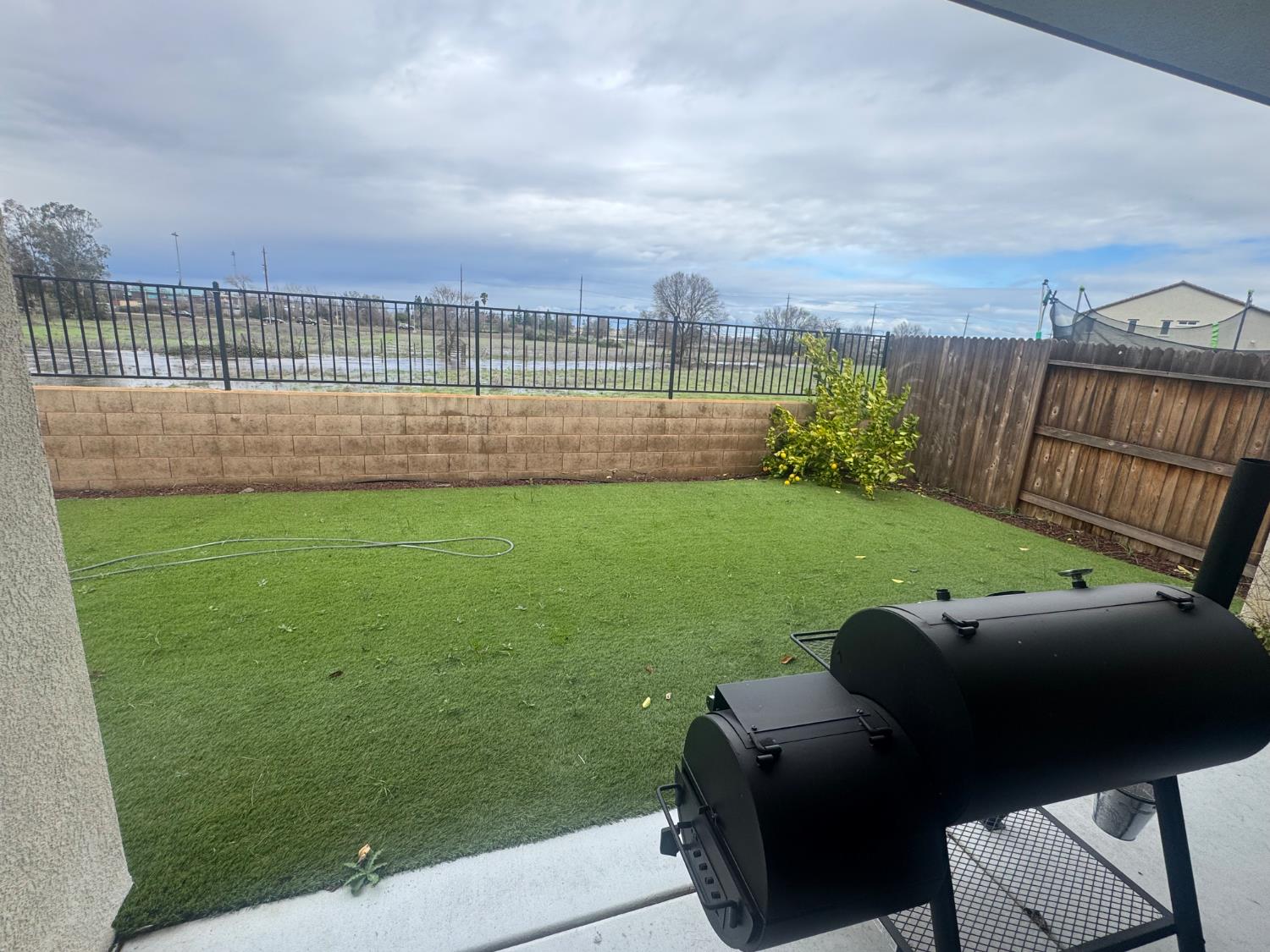 9475 Pasaje Place Elk Grove, CA 95624 - Photo 23 of 26 a view of a garden with lawn chairs
