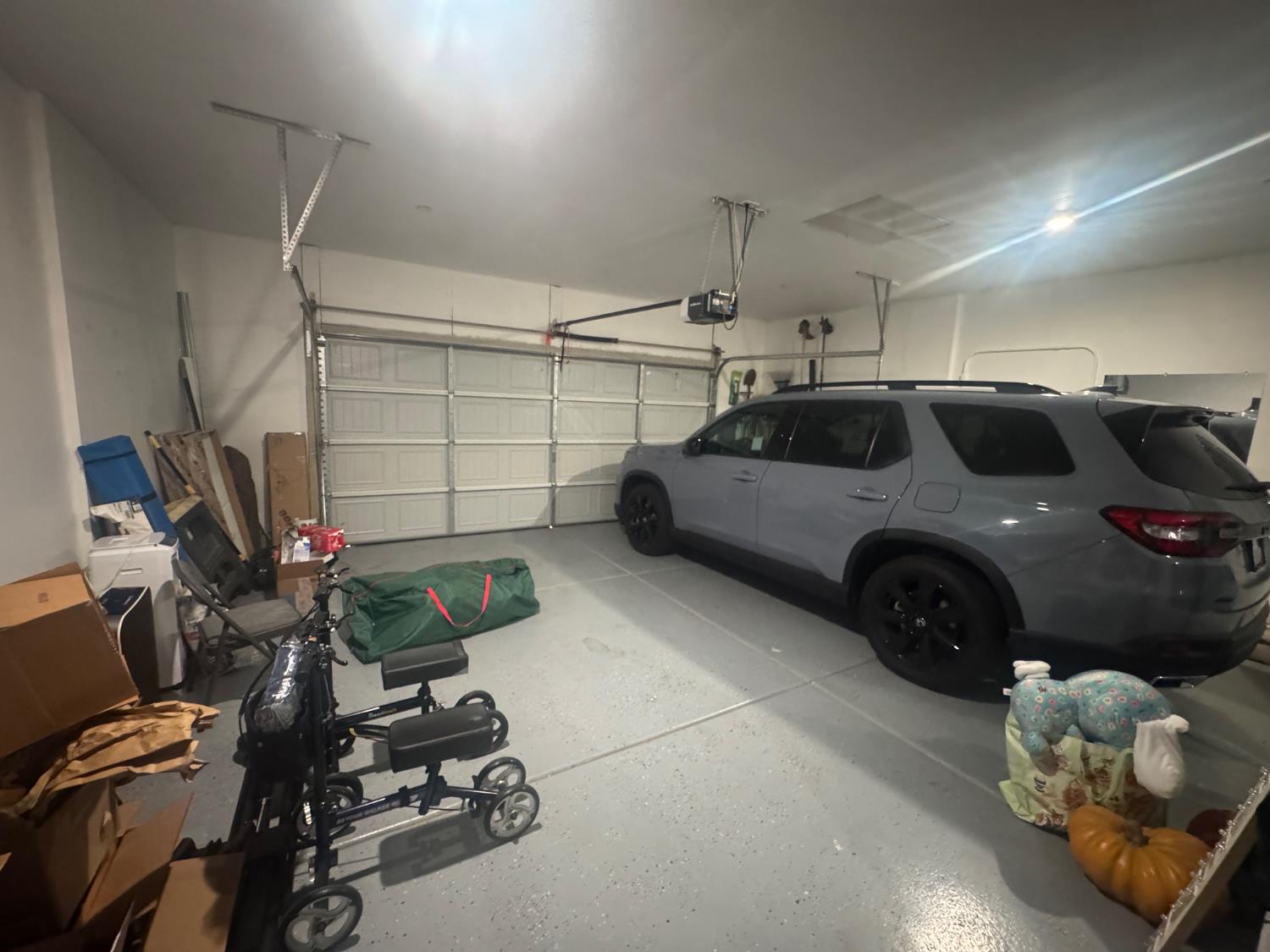 9475 Pasaje Place Elk Grove, CA 95624 - Photo 25 of 26 a car parked in a garage