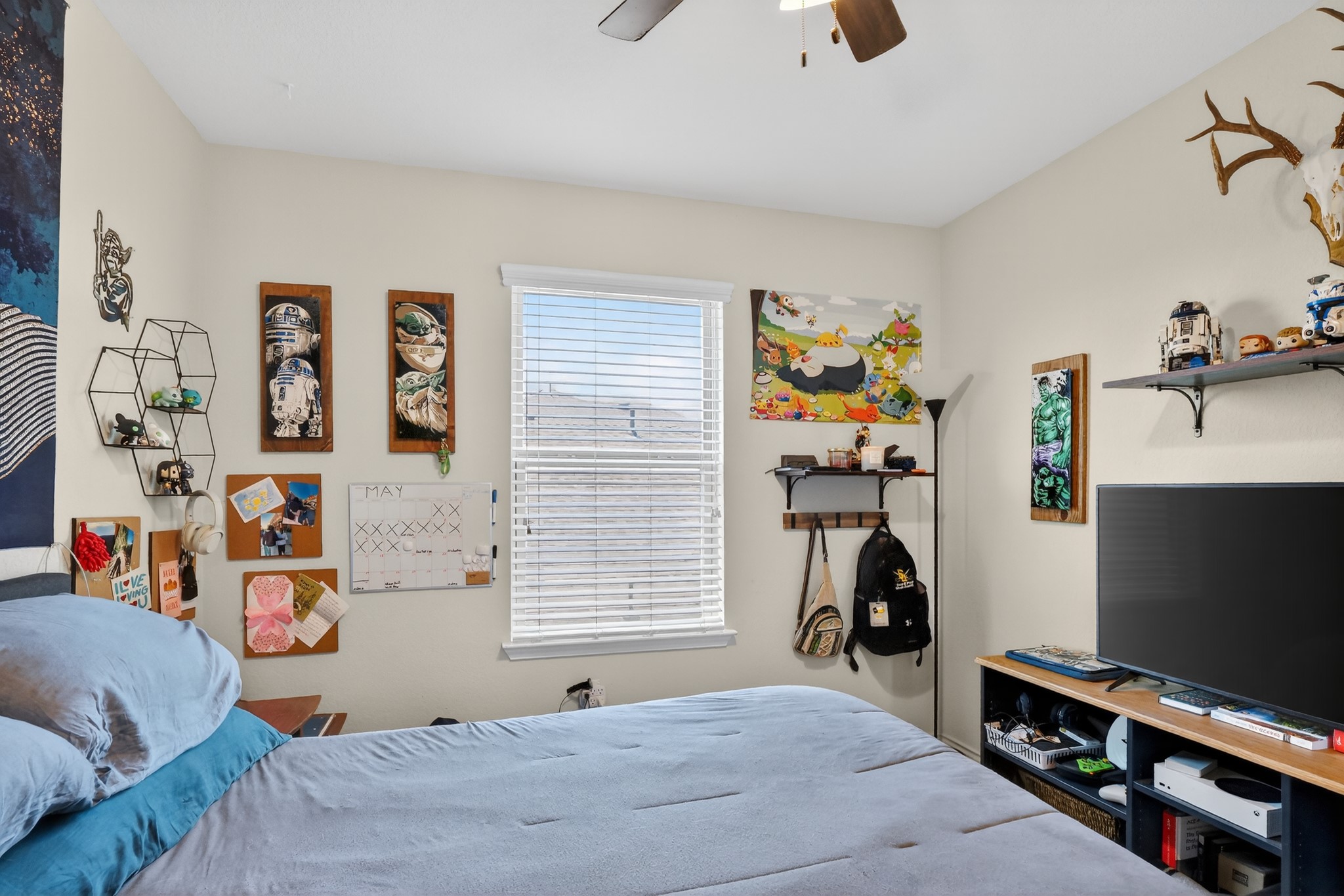 521 Staton Street Georgetown, TX 78626 - Photo 24 of 39 a bedroom with a bed and a flat tv screen