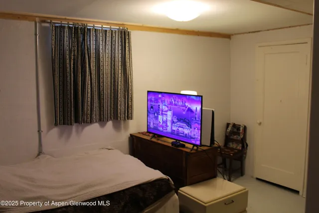 a room with furniture and a flat screen tv