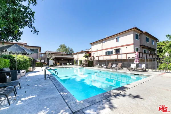 a view of a swimming pool with a patio