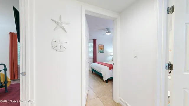 a kitchen with stainless steel appliances a refrigerator sink and white cabinets