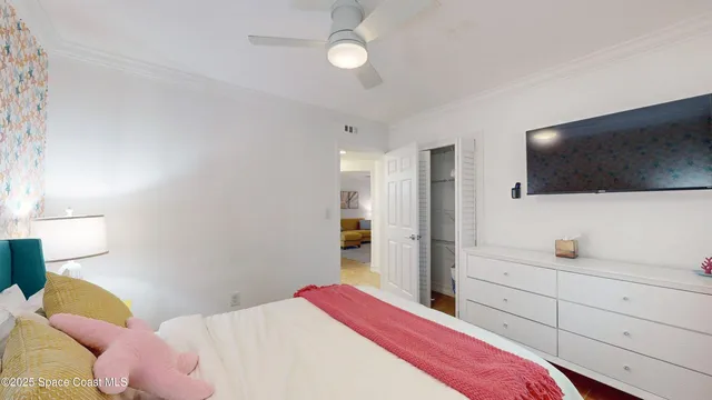 a bed room with a bed and a chair