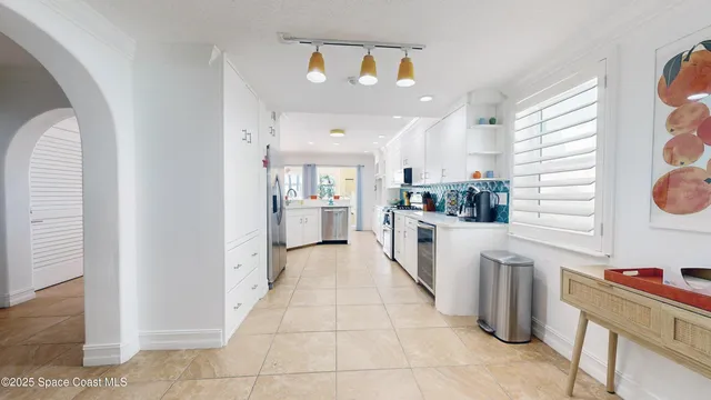 a bathroom with a granite countertop sink a mirror and shower