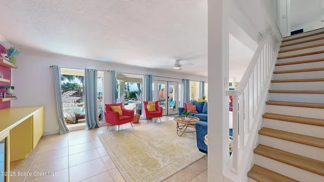 a bedroom with a large bed and a flat tv screen