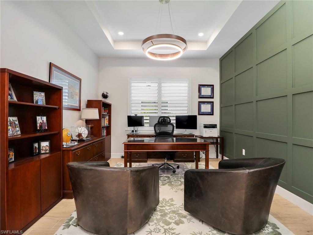 18412 Ridgeline Drive Estero, FL 33928 - Photo 8 of 50 a living room with furniture and a table