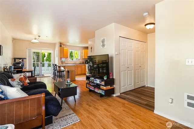 a view of a livingroom with furniture and floor to ceiling window
