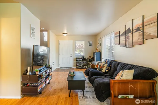 a living room with furniture and a flat screen tv