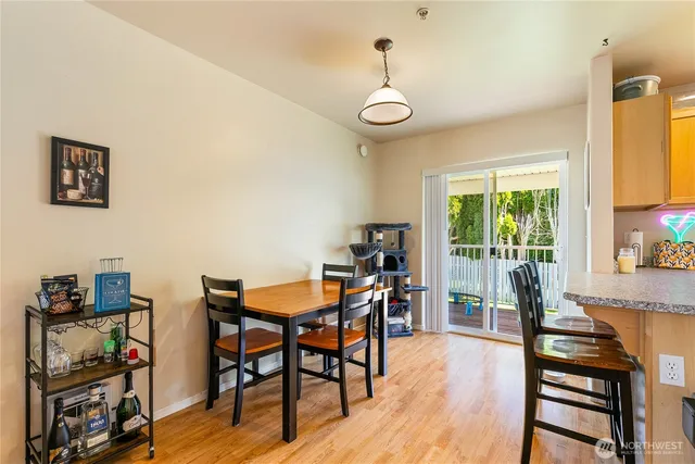 a view of a dining room with furniture and wooden floor