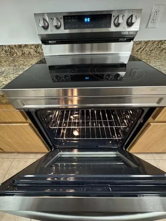 a kitchen with granite countertop a sink and a granite counter tops