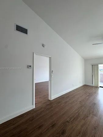 a view of a hallway with seating area