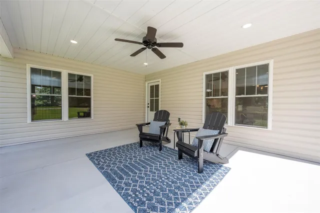 a living room with furniture and windows