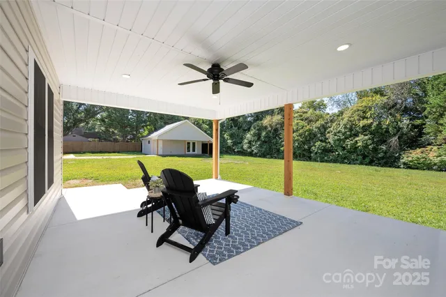 a view of a swimming pool with a back yard
