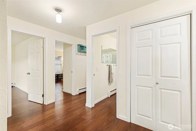 an empty room with wooden floor