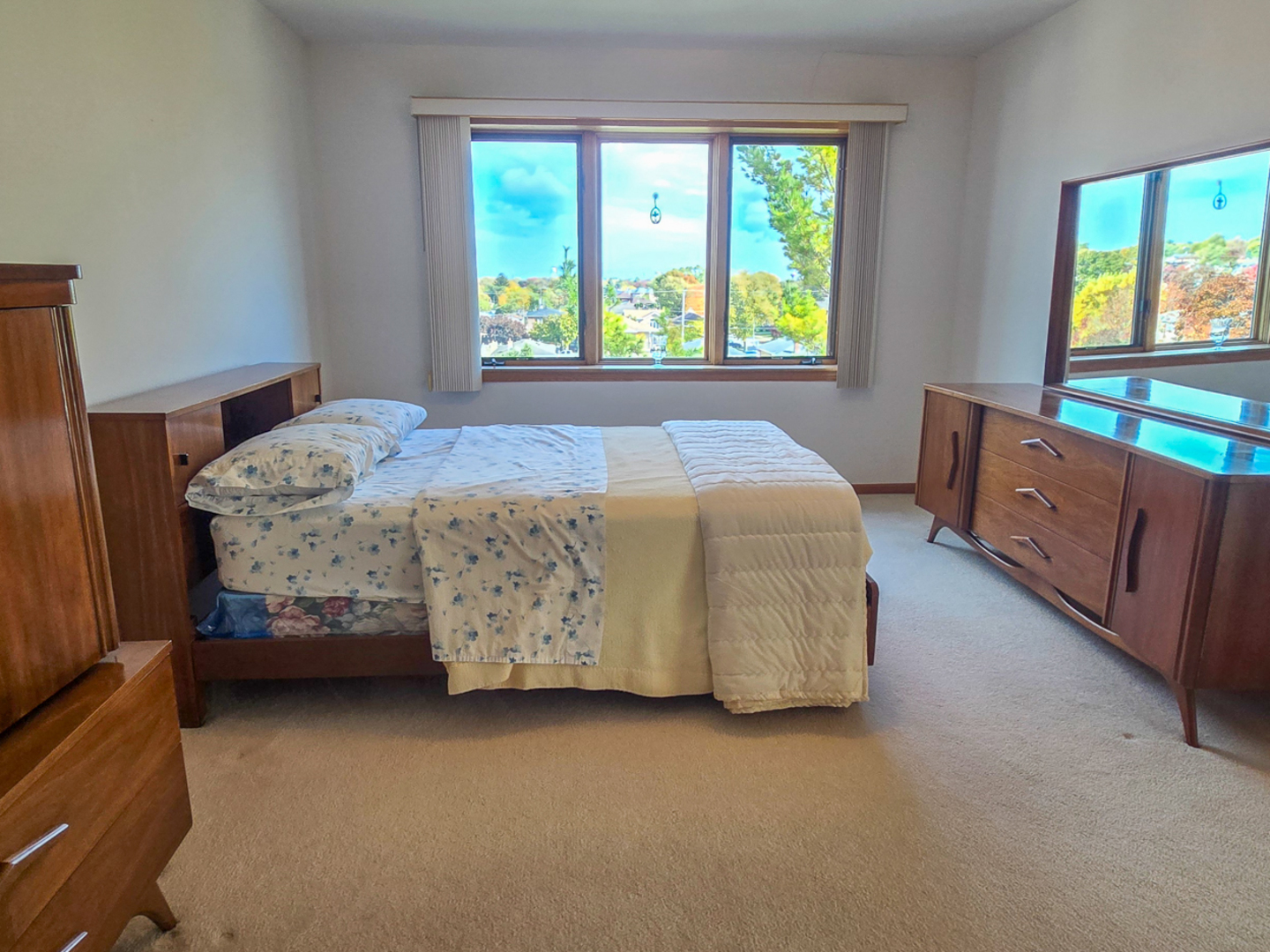 4655 North Cumberland Avenue, Unit 502 Norridge, IL 60706 - Photo 7 of 11 a bedroom with a bed and two windows