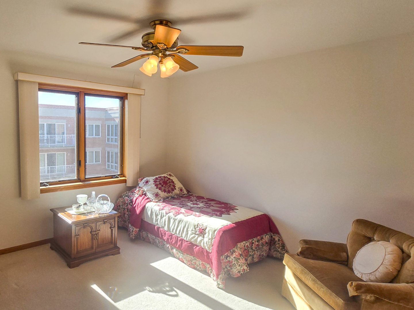 4655 North Cumberland Avenue, Unit 502 Norridge, IL 60706 - Photo 8 of 11 a bedroom with a bed and window