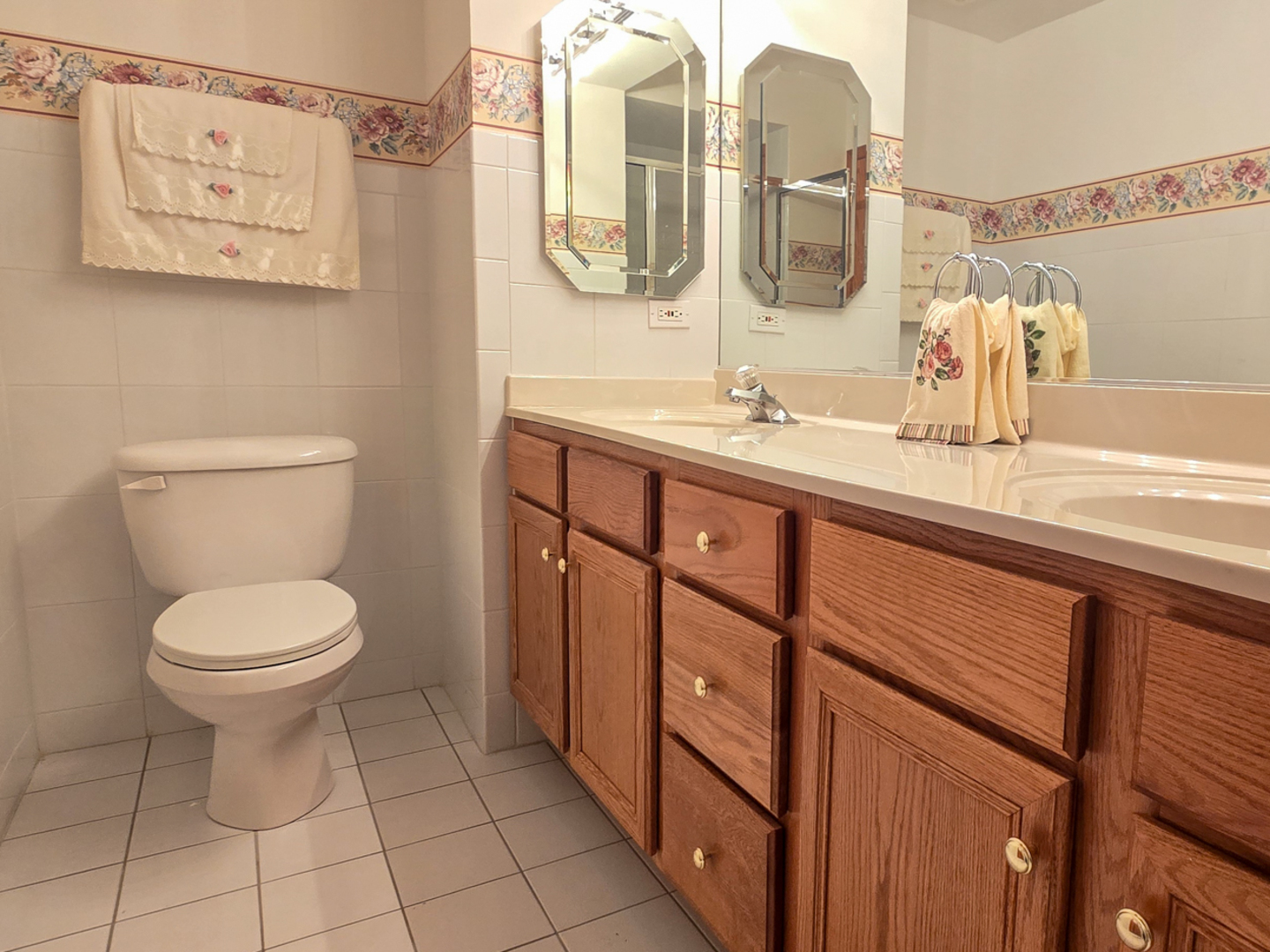 4655 North Cumberland Avenue, Unit 502 Norridge, IL 60706 - Photo 9 of 11 a bathroom with a toilet sink and mirror