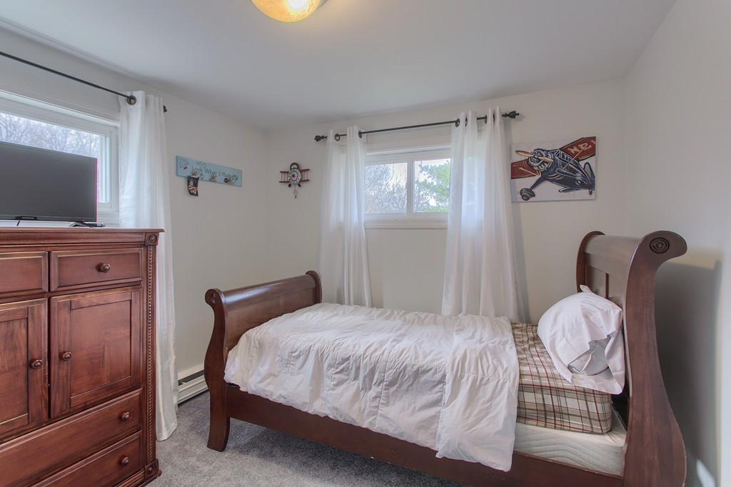 547 Boston Road Billerica, MA 01821 - Photo 17 of 23 a bedroom with a bed and wooden floor