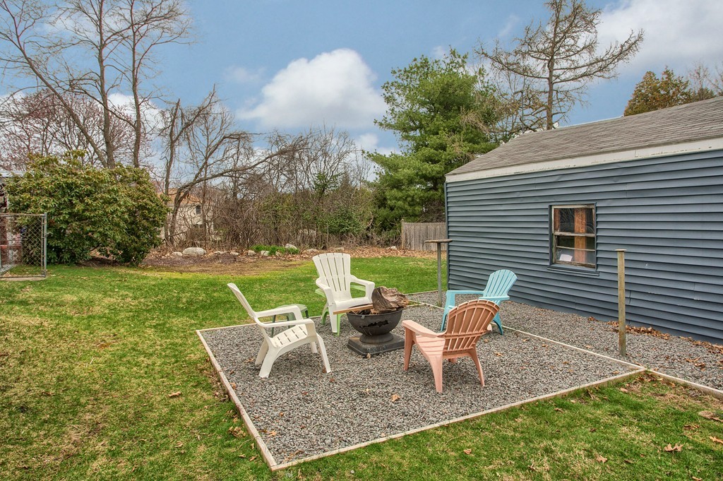 547 Boston Road Billerica, MA 01821 - Photo 23 of 23 a view of a chair and table in the backyard