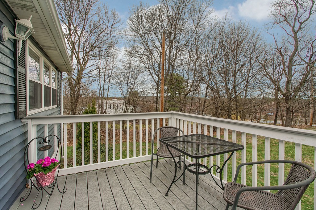 547 Boston Road Billerica, MA 01821 - Photo 5 of 23 a view of a chair and table on the roof deck