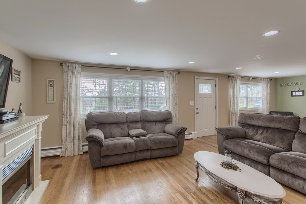 547 Boston Road Billerica, MA 01821 - Photo 7 of 23 a living room with furniture and a flat screen tv