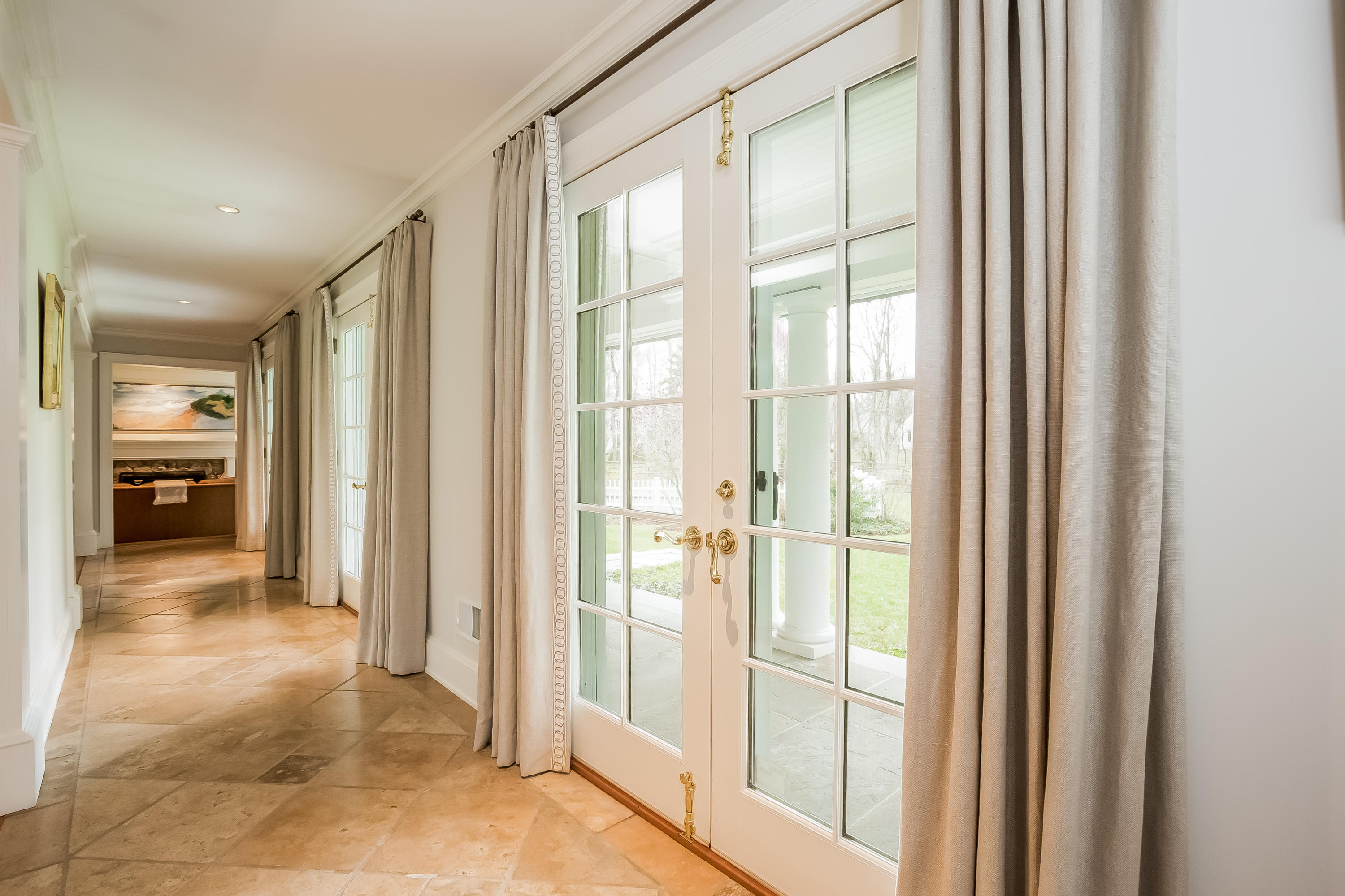 8 Haskell Lane Darien, CT 06820 - Photo 16 of 31 a view of a hallway with furniture and a livingroom view