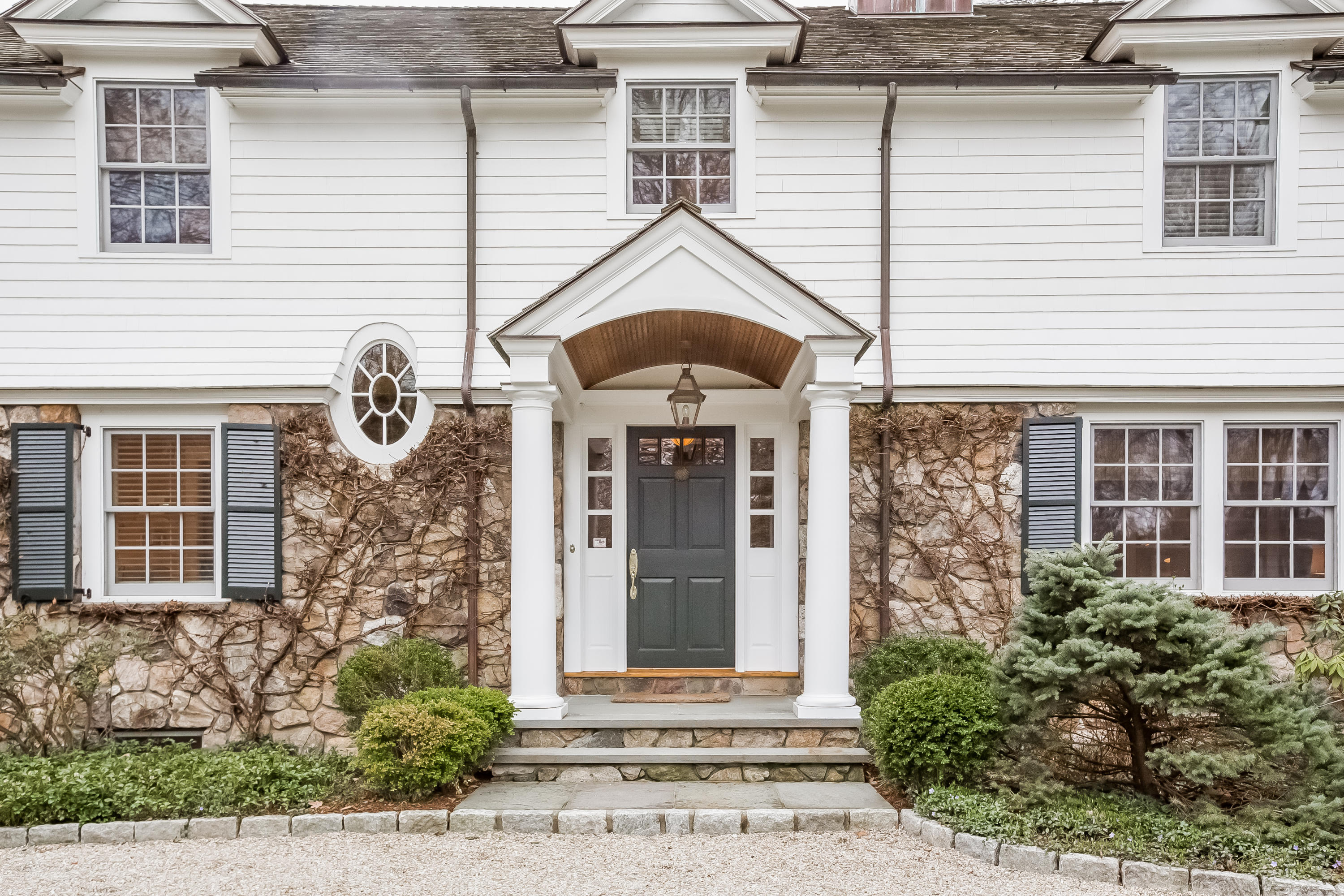 8 Haskell Lane Darien, CT 06820 - Photo 2 of 31 a front view of a house with a yard