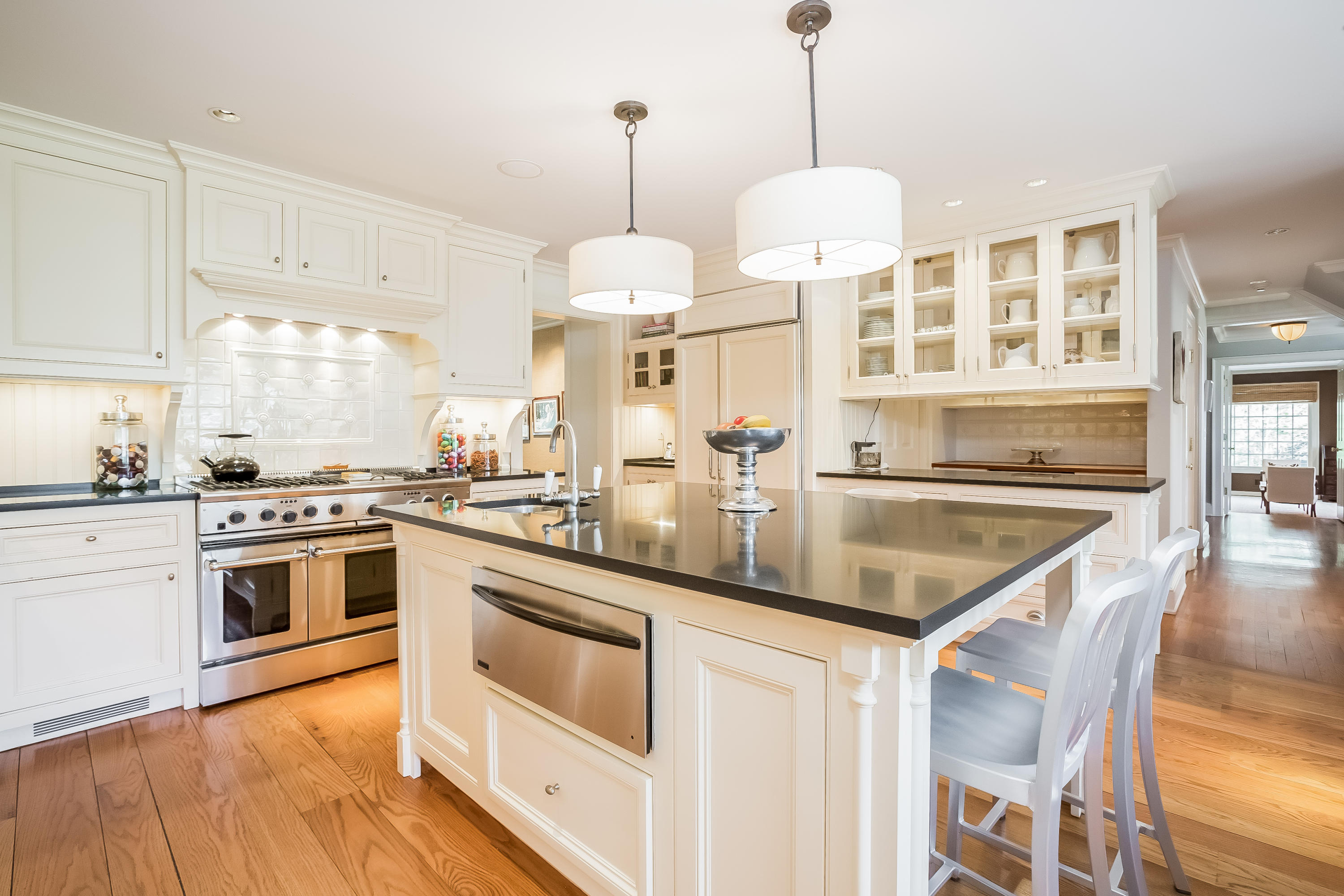 8 Haskell Lane Darien, CT 06820 - Photo 8 of 31 a kitchen with stainless steel appliances granite countertop a stove a sink and a refrigerator