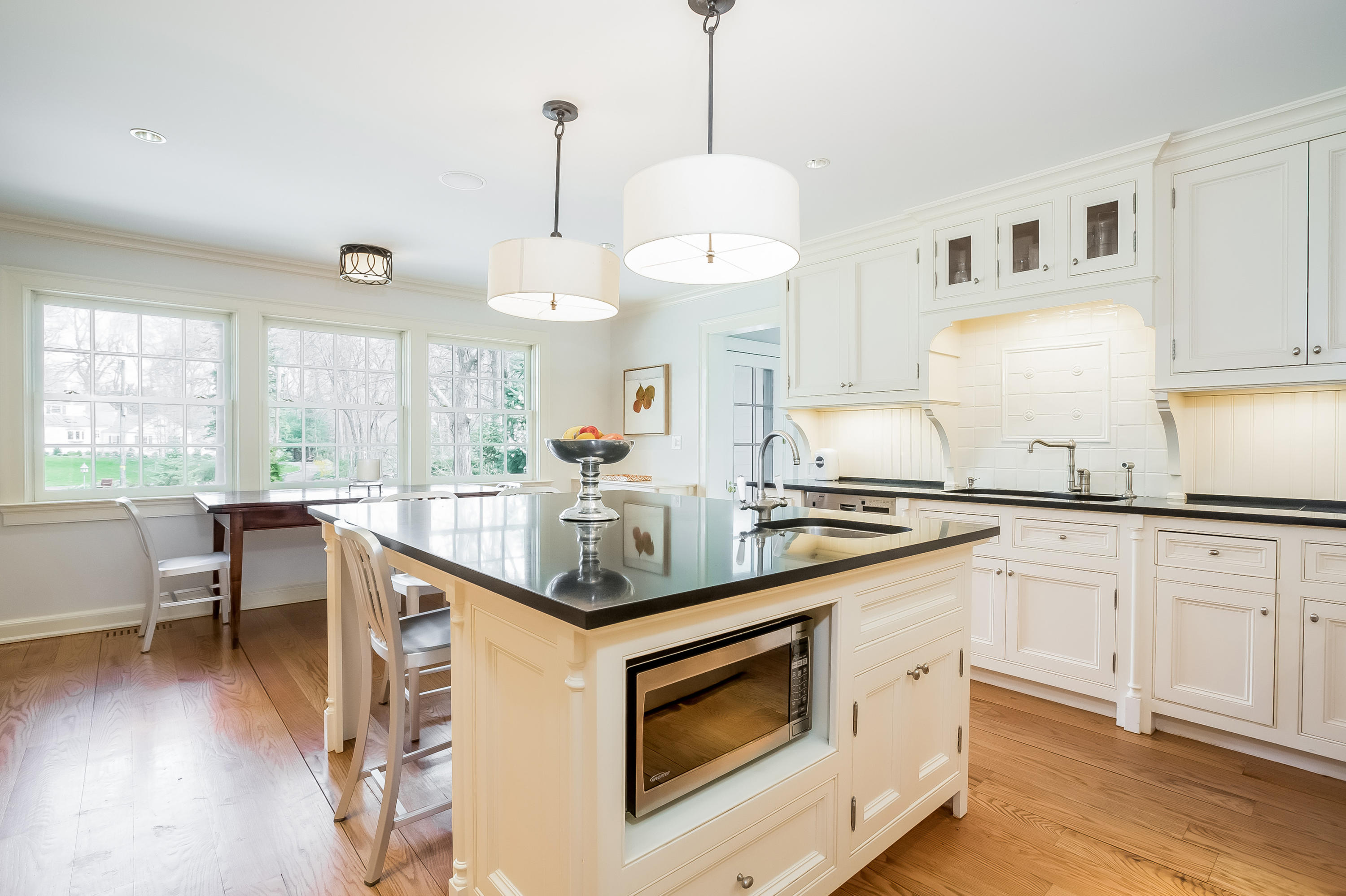 8 Haskell Lane Darien, CT 06820 - Photo 9 of 31 a kitchen with a stove cabinets and wooden floor