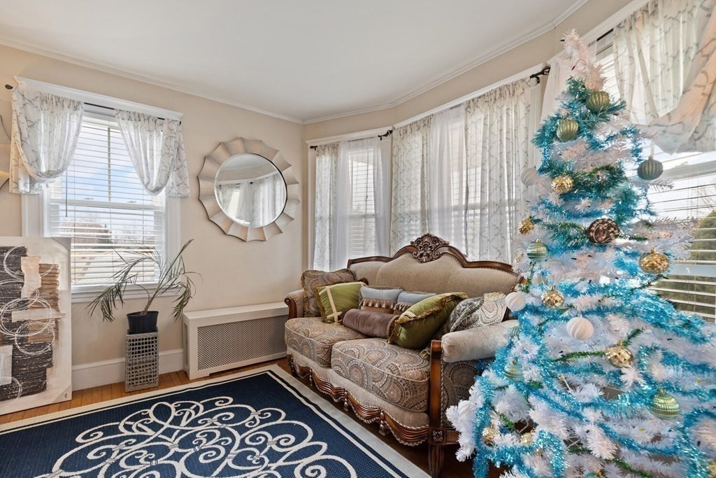 57 Chadwick Road Haverhill, MA 01835 - Photo 11 of 25 a living room with furniture and a potted plant