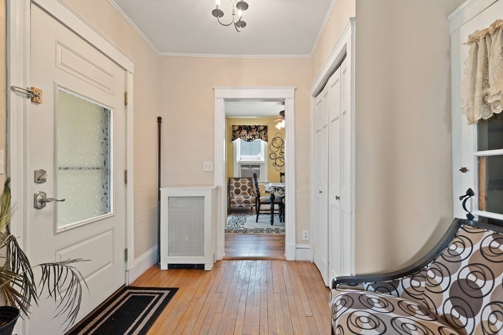 57 Chadwick Road Haverhill, MA 01835 - Photo 6 of 25 a view of a hallway with wooden floor and windows