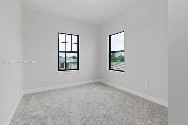 an empty room with windows