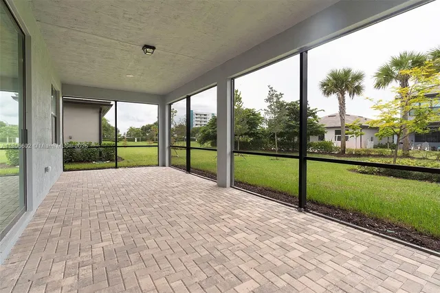 a view of a house with a tree in a yard