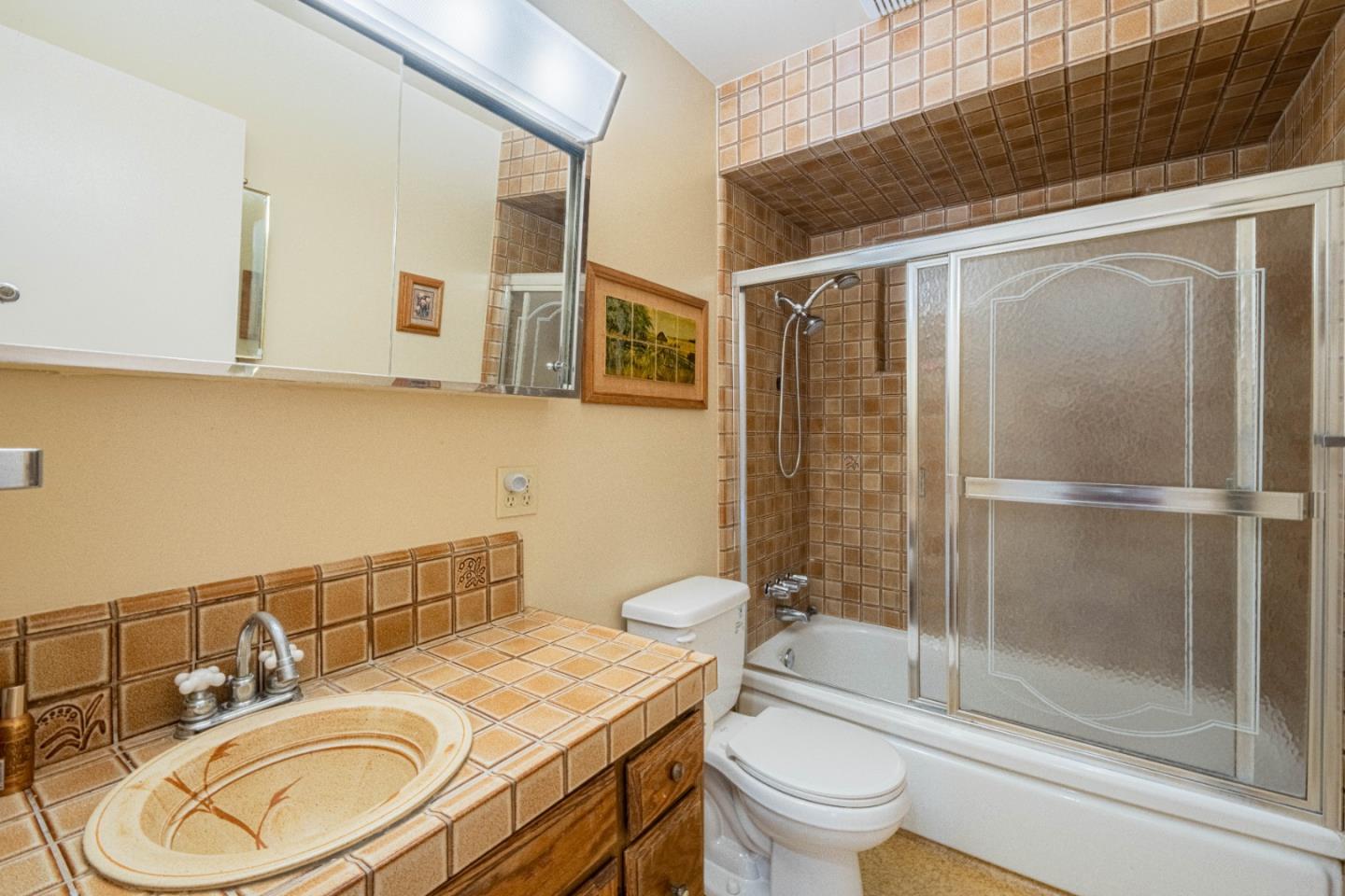 24 St Francis Way Salinas, CA 93906 - Photo 14 of 25 a bathroom with a granite countertop sink toilet and shower