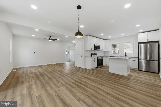 a view of kitchen with cabinets and stainless steel appliances