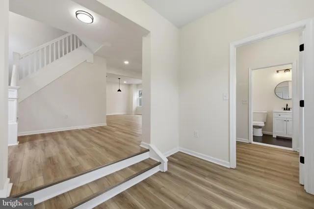 a view of an empty room and wooden floor