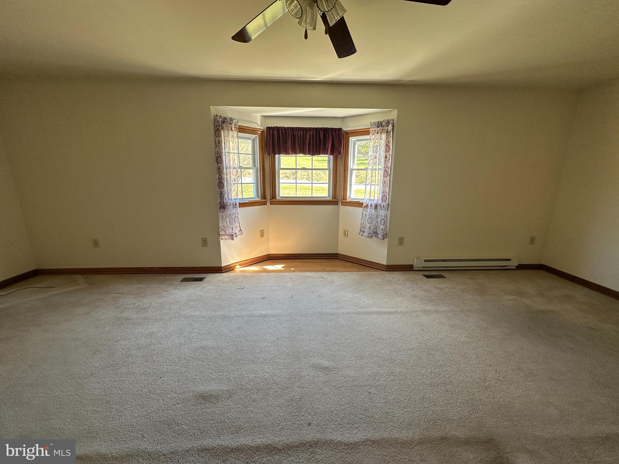 1-794 Harbaugh Valley Road Fairfield, PA 17320 - Photo 34 of 95 an empty room with ceiling fan and window