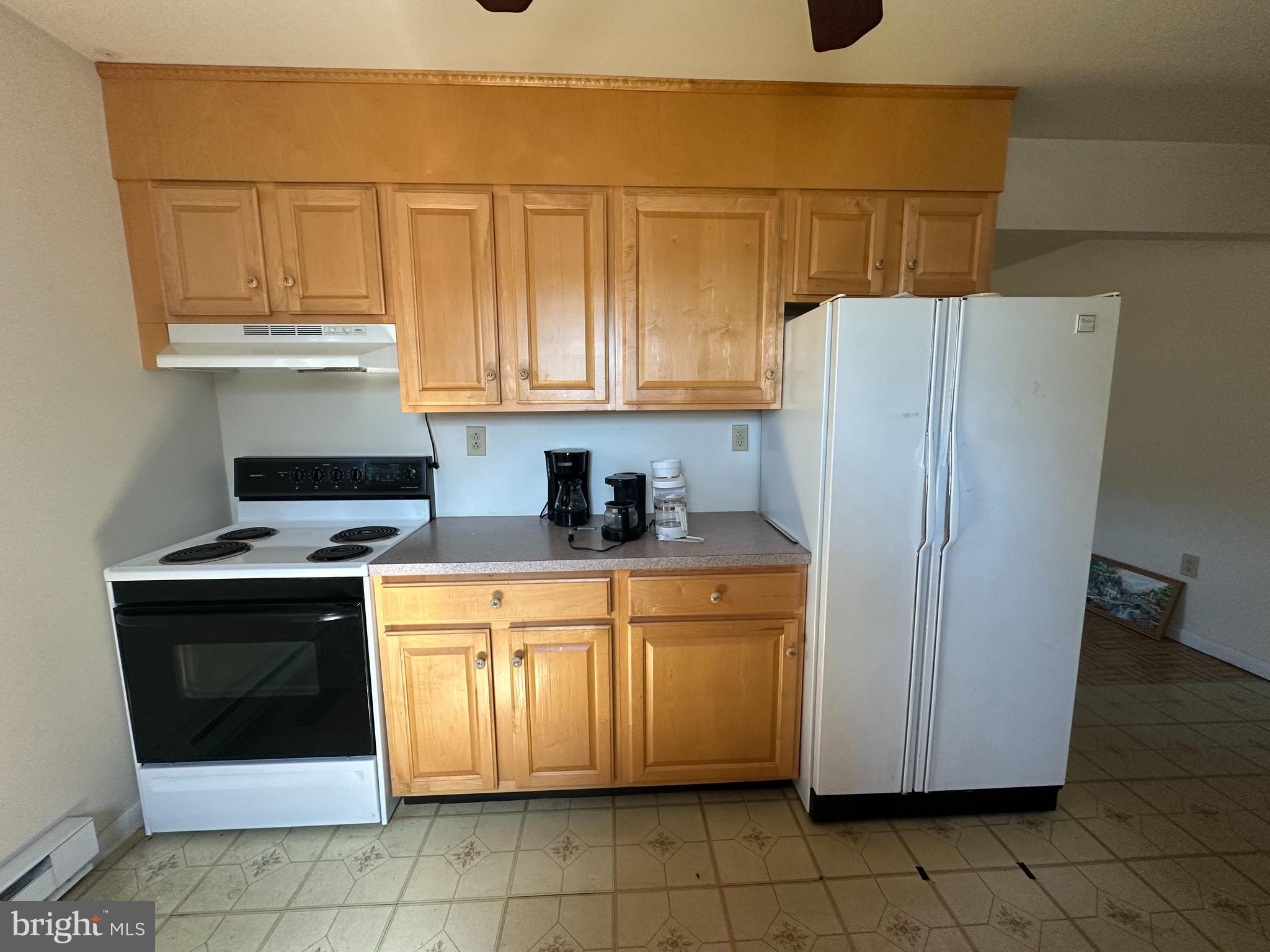 1-794 Harbaugh Valley Road Fairfield, PA 17320 - Photo 39 of 95 a kitchen with stainless steel appliances granite countertop a stove a refrigerator and a cabinets