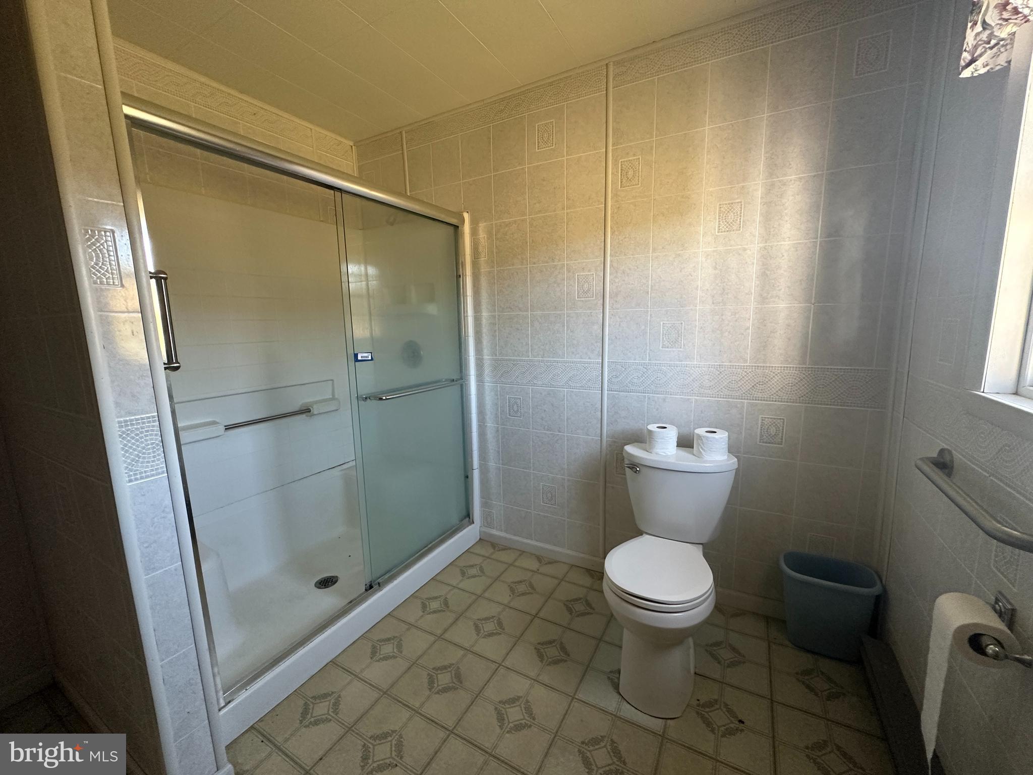 1-794 Harbaugh Valley Road Fairfield, PA 17320 - Photo 49 of 95 a bathroom with a granite countertop toilet a sink and shower