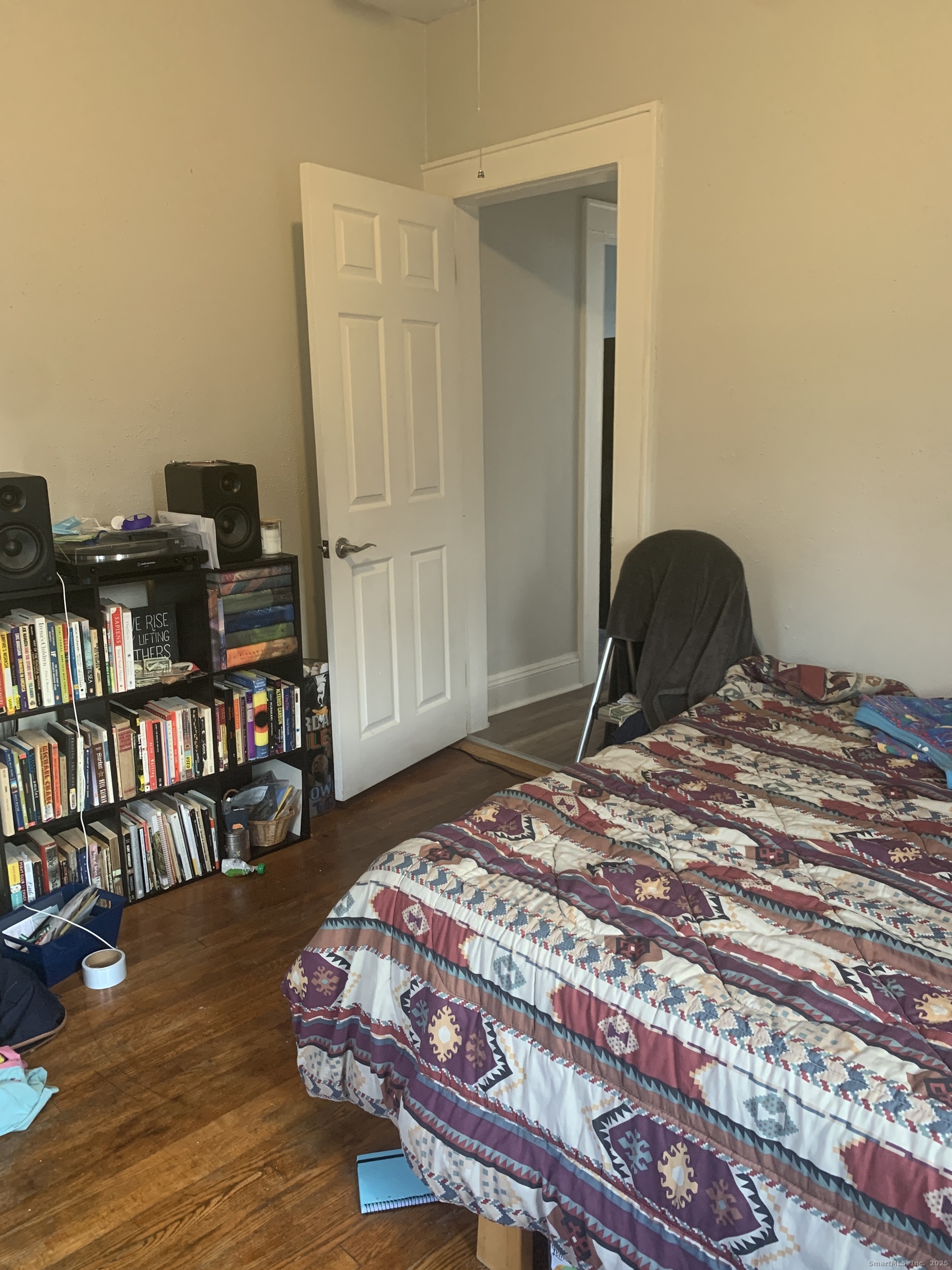 96 Seaview Terrace Bridgeport, CT 06605 - Photo 19 of 23 a bedroom with a bed and a book shelf