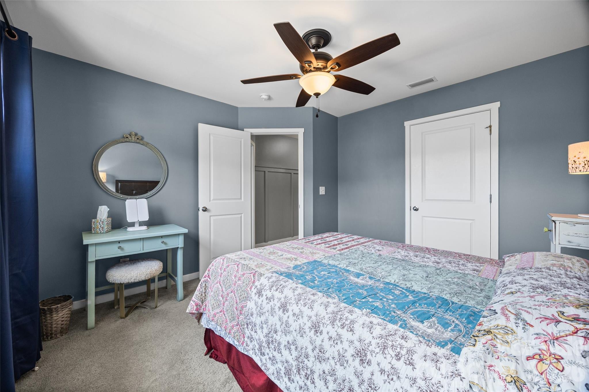 334 Battery Circle Clover, SC 29710 - Photo 17 of 29 a bedroom with a bed and a chandelier