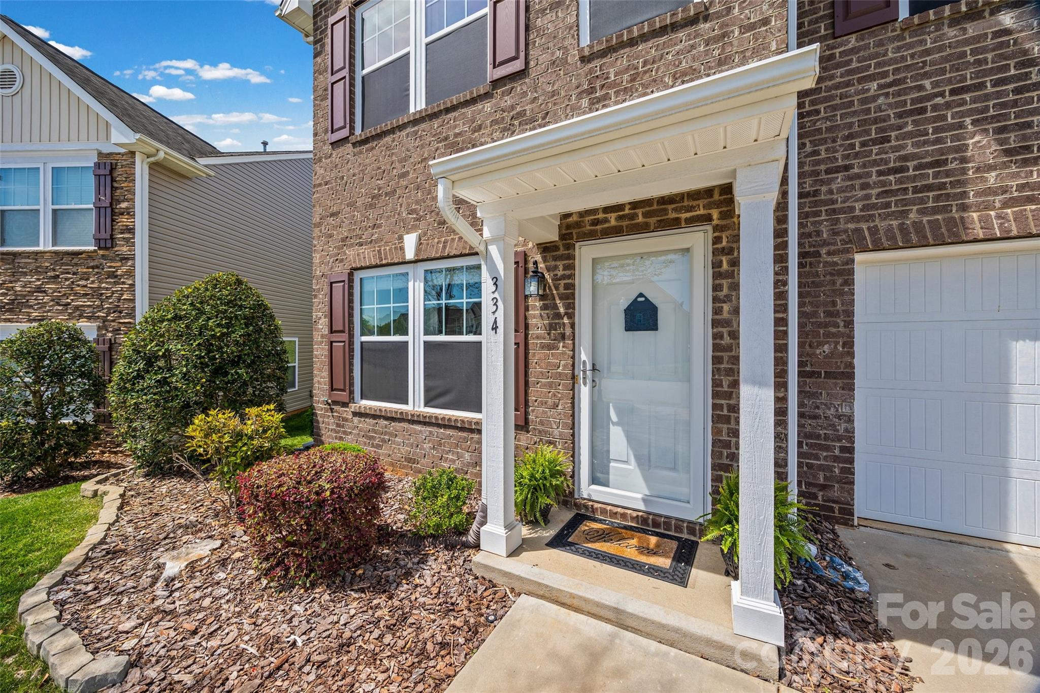 334 Battery Circle Clover, SC 29710 - Photo 2 of 29 a front view of a house with a garden
