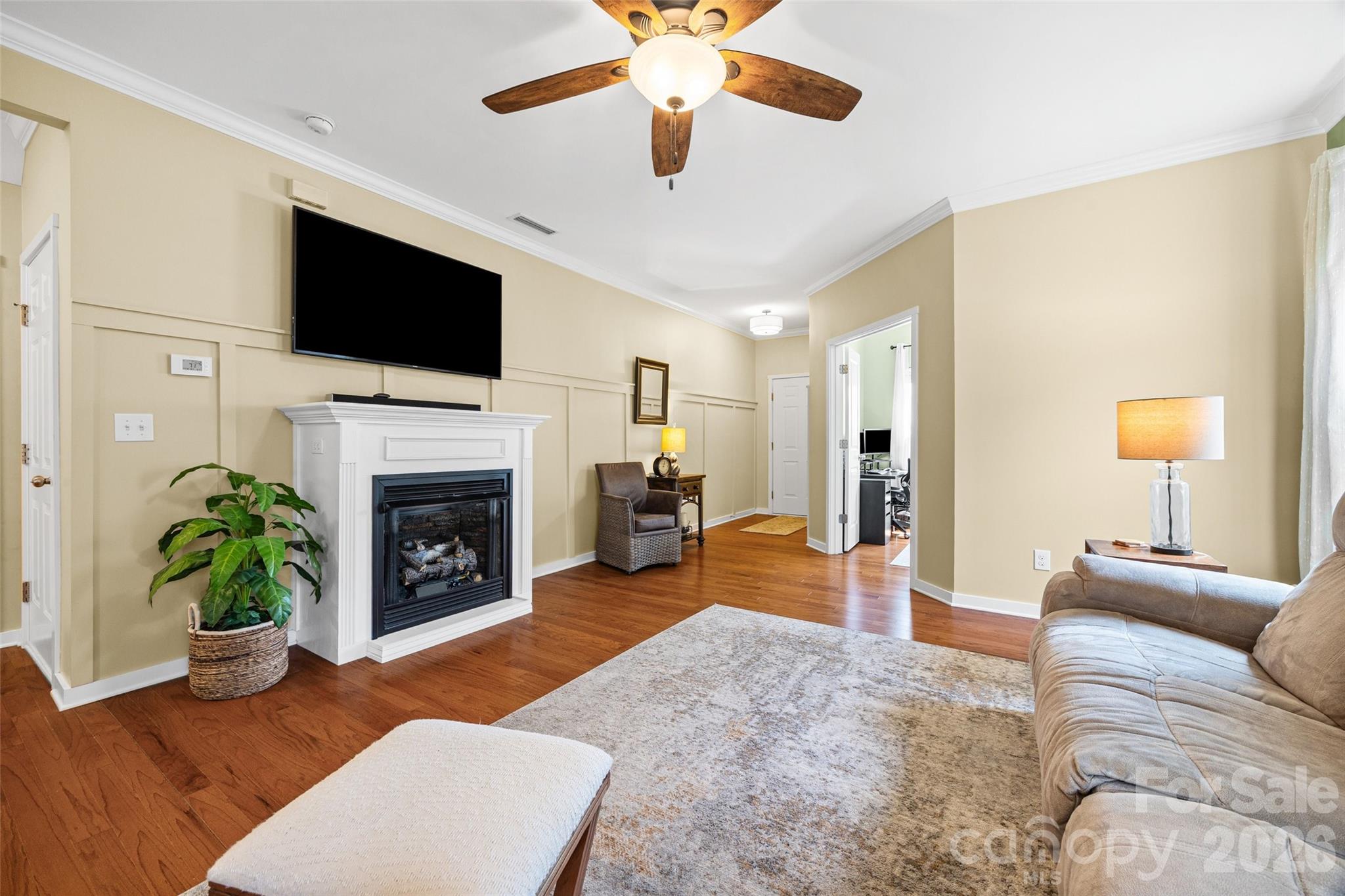 334 Battery Circle Clover, SC 29710 - Photo 4 of 29 a living room with furniture a flat screen tv and a fireplace
