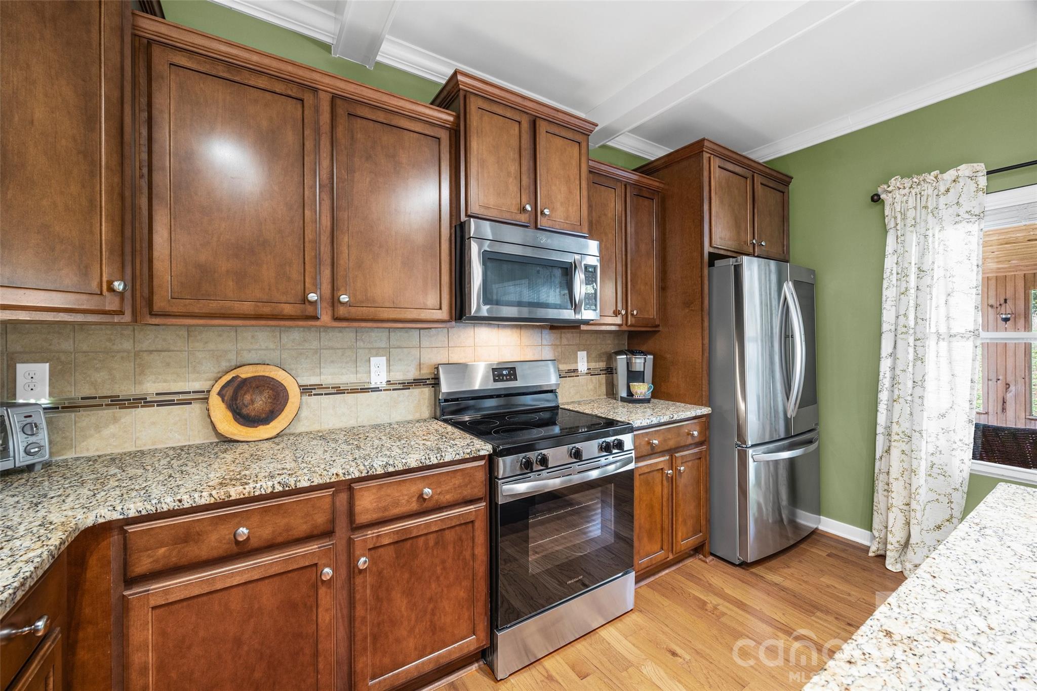 334 Battery Circle Clover, SC 29710 - Photo 10 of 29 a kitchen with stainless steel appliances granite countertop a refrigerator stove and sink