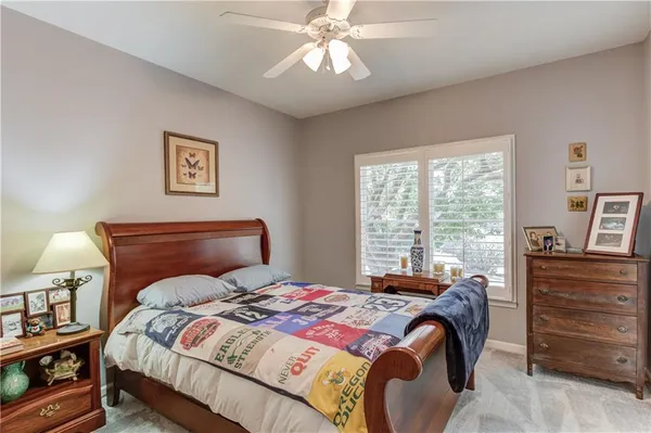 a view of a livingroom with furniture and a window